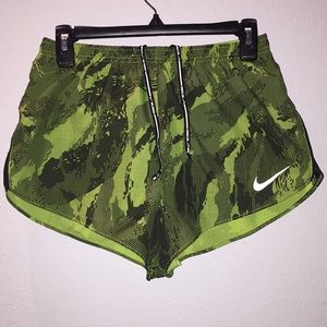 Neon yellow Nike shorts, size M.